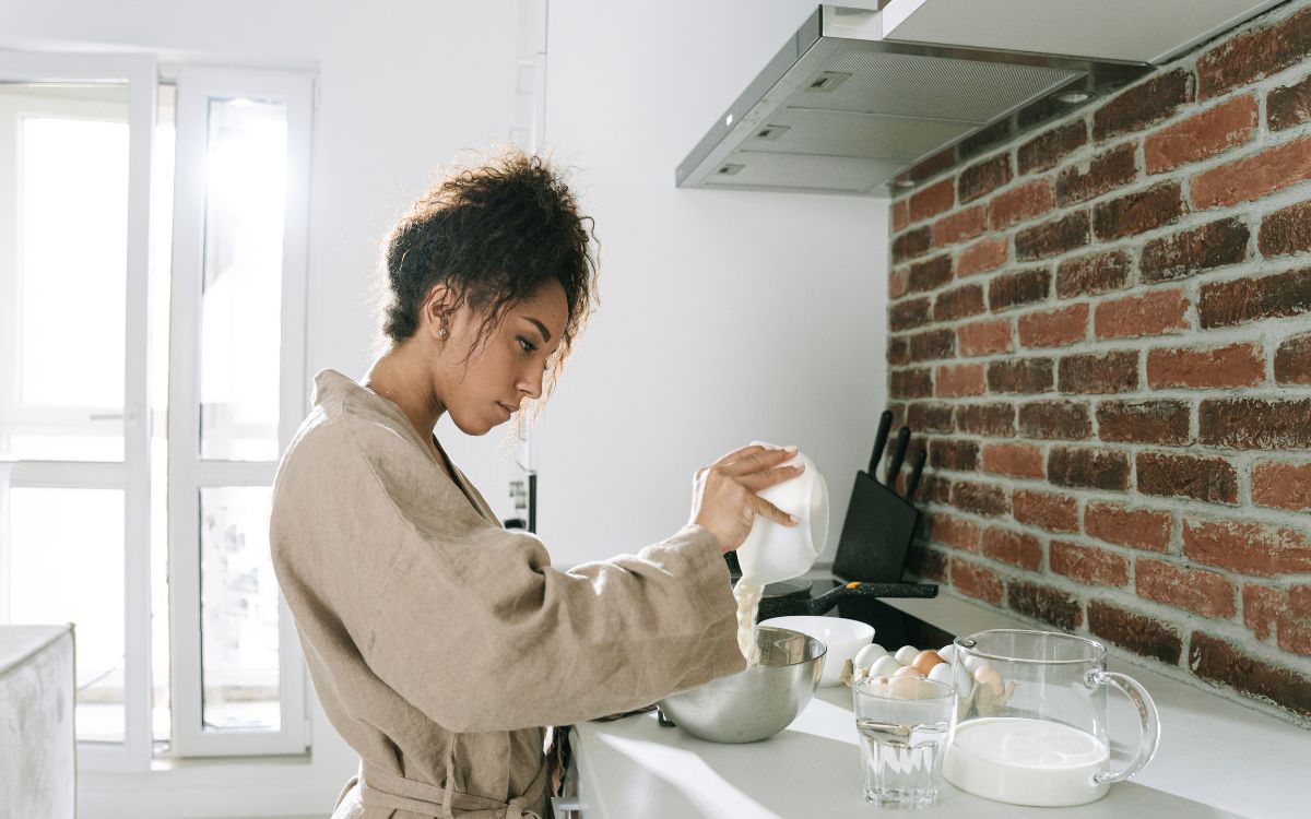 a woman in the kitchen learning life skills