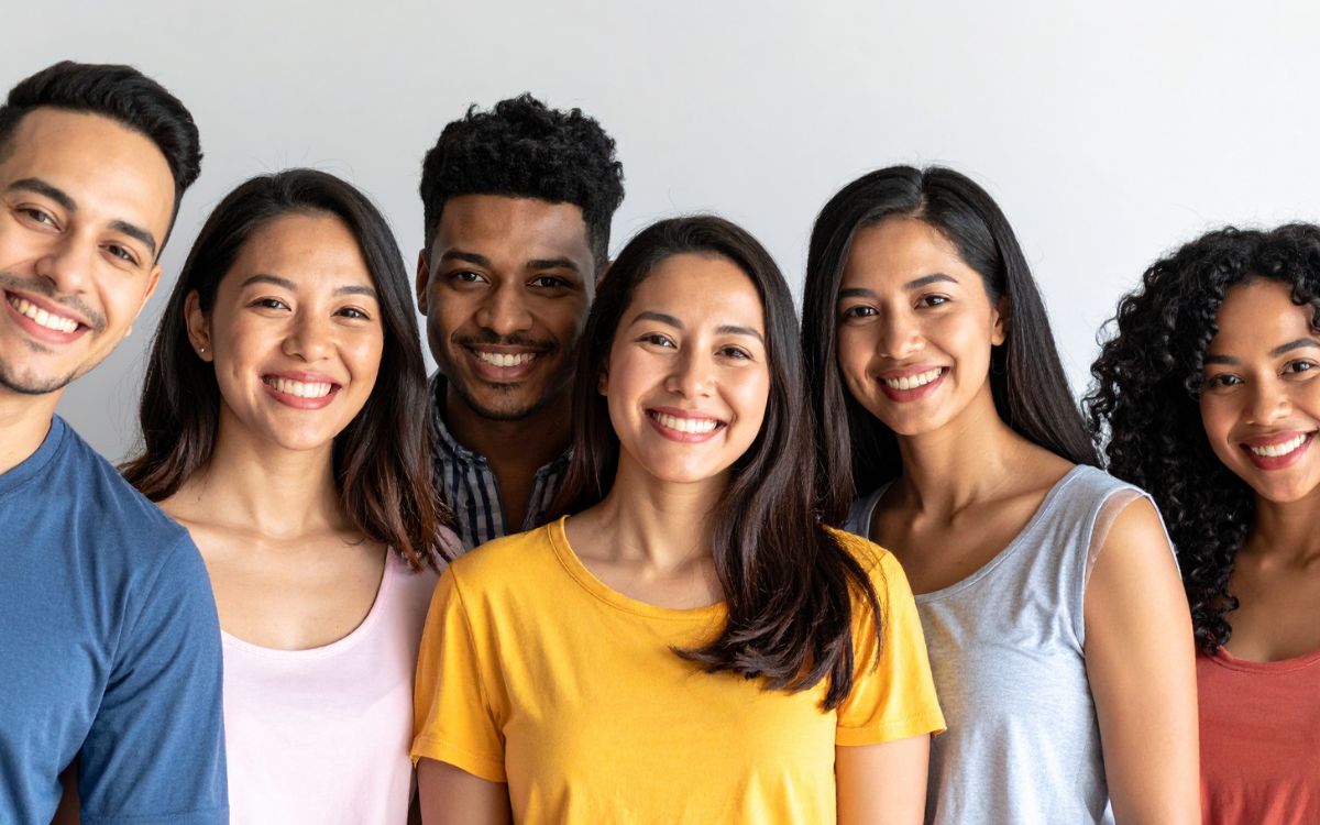 a group of young adults smiling at the camera
